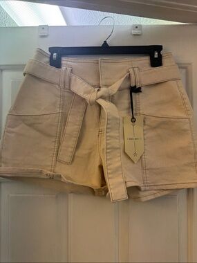 High-Rise Belted Denim Shorts in Cream